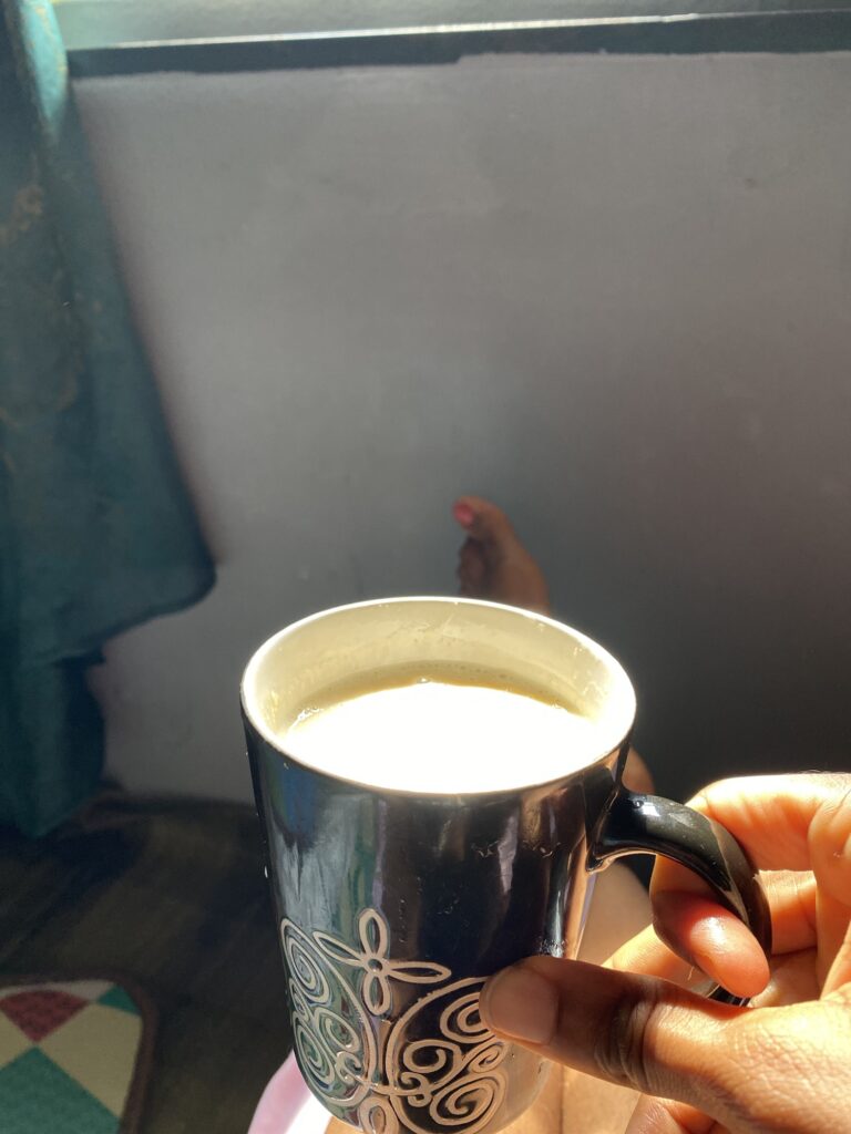 My tea-stained ceramic cup featuring my newly painted wall.